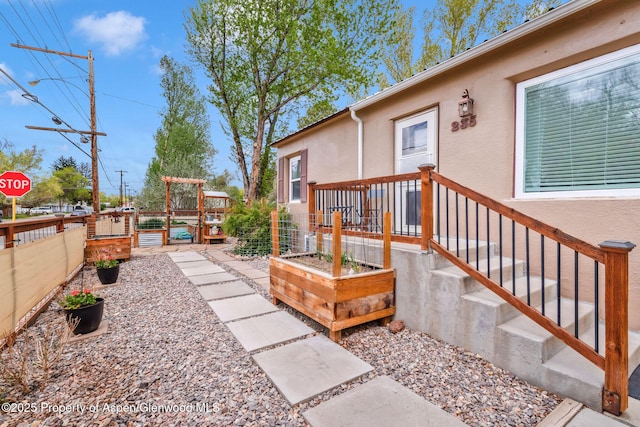 235 W 8th St, Craig, CO 81625 - view of patio / terrace featuring a garden and fence