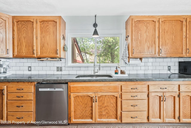 235 W 8th St, Craig, CO 81625 - kitchen with stainless steel dishwasher, a sink, backsplash, and black microwave