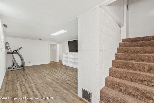 235 W 8th St, Craig, CO 81625 - finished basement featuring light wood-style flooring and stairs