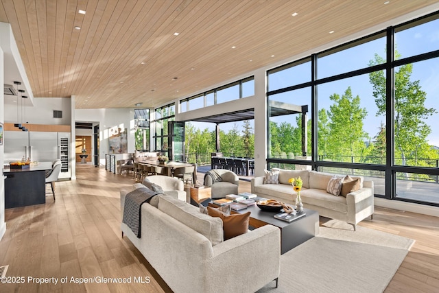 1234 Wood Rd, Snowmass Village, CO 81615 - living room featuring wood ceiling, a wall of windows, light wood finished floors, a towering ceiling, and recessed lighting