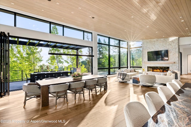 1234 Wood Rd, Snowmass Village, CO 81615 - building lobby featuring wood ceiling, a high ceiling, a wall of windows, and recessed lighting