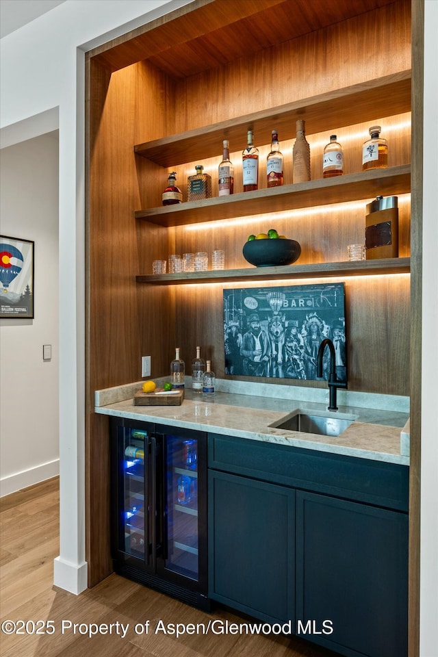 1234 Wood Rd, Snowmass Village, CO 81615 - indoor bar featuring baseboards, wine cooler, and wood finished floors