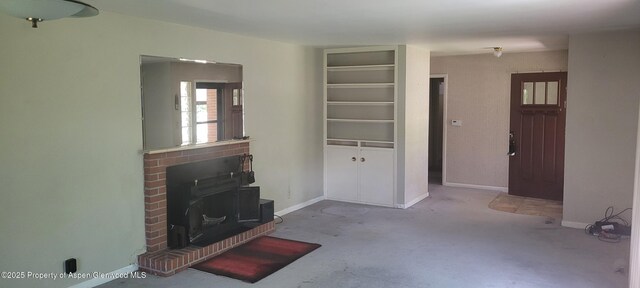 888 Pershing St, Craig, CO 81625 - unfurnished living room featuring carpet flooring and a wood stove