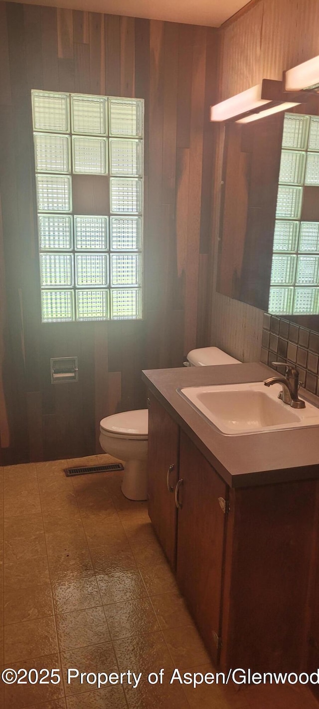 888 Pershing St, Craig, CO 81625 - bathroom featuring vanity and wood walls