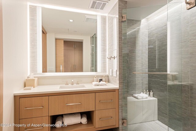 bathroom with vanity and walk in shower