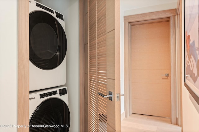 laundry area featuring stacked washer and dryer