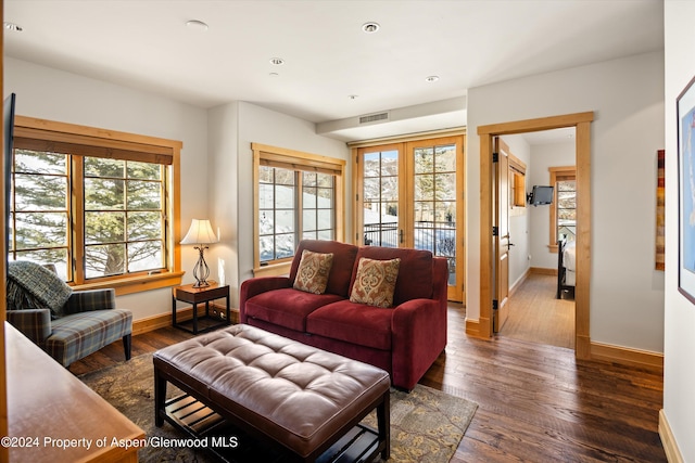 living room featuring french doors and dark hardwood / wood-style floors