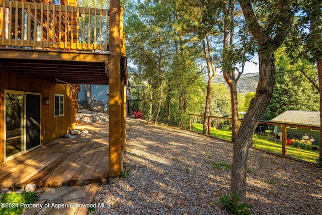 view of yard with a wooden deck