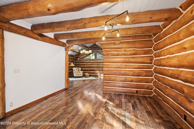 bonus room featuring beam ceiling, hardwood / wood-style flooring, rustic walls, and wooden ceiling