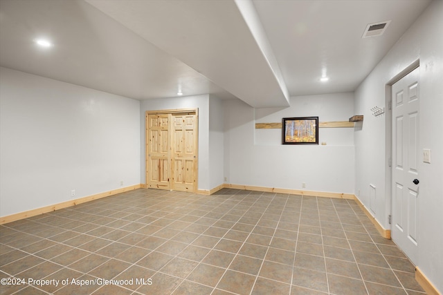 basement with tile patterned flooring