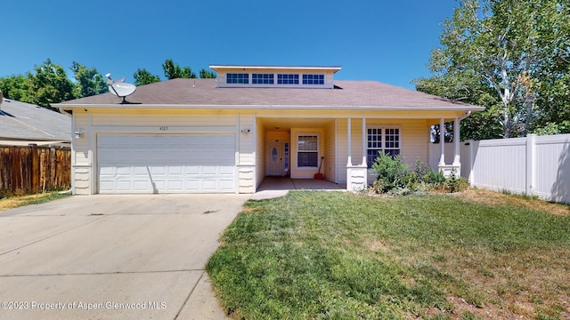 view of front of home featuring solar panels, covered porch, a front yard, and a garage