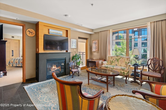 130 Wood Rd Unit 625, Snowmass Village, CO 81615 - living room with a glass covered fireplace and granite tiled floors