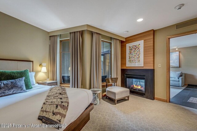 130 Wood Rd Unit 625, Snowmass Village, CO 81615 - bedroom featuring carpet flooring, access to outside, and a multi sided fireplace