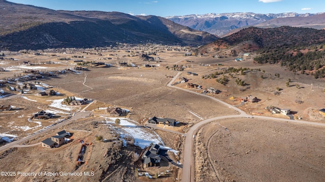 birds eye view of property featuring a mountain view