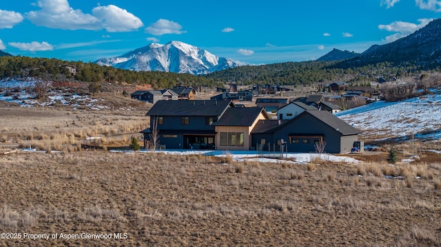 back of house featuring a mountain view