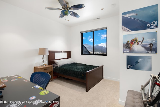 carpeted bedroom featuring visible vents, ceiling fan, and baseboards