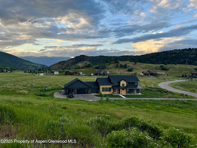 mountain view featuring a rural view