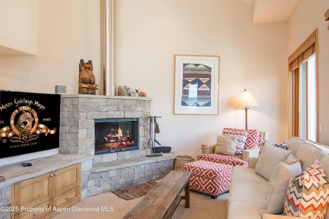 425 Wood Rd Unit 48, Snowmass Village, CO 81615 - carpeted living room with a stone fireplace