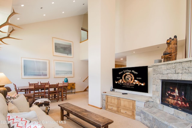 425 Wood Rd Unit 48, Snowmass Village, CO 81615 - carpeted living area with high vaulted ceiling, stairs, a fireplace, and recessed lighting