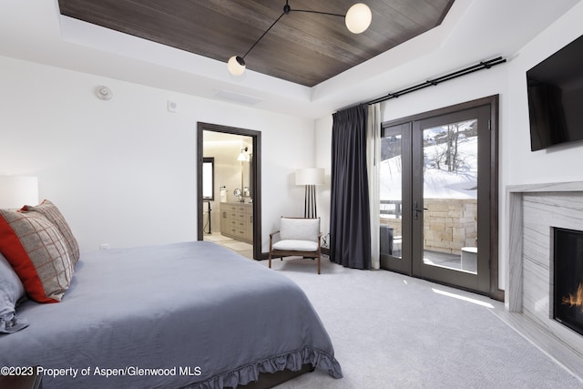 65 Wood Rd Unit 233, Snowmass Village, CO 81615 - bedroom with a raised ceiling, access to outside, wood ceiling, carpet, and ensuite bathroom