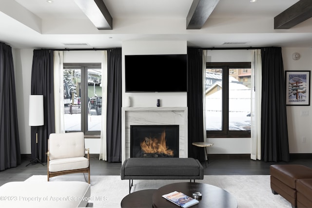 65 Wood Rd Unit 233, Snowmass Village, CO 81615 - living area with wood finished floors, a high end fireplace, beamed ceiling, and recessed lighting