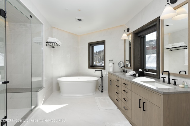 65 Wood Rd Unit 233, Snowmass Village, CO 81615 - full bath featuring a freestanding tub, double vanity, and a stall shower