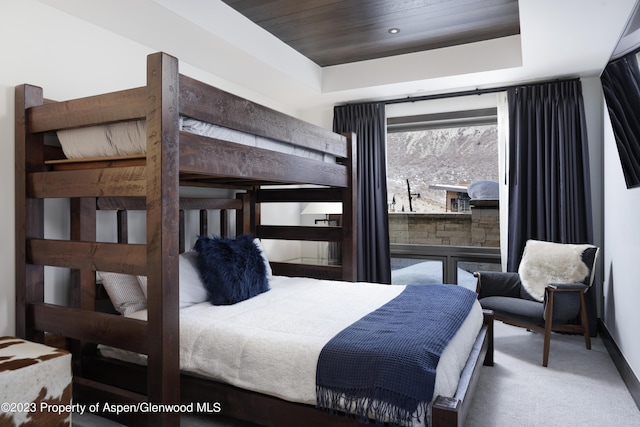 65 Wood Rd Unit 233, Snowmass Village, CO 81615 - bedroom with a raised ceiling, carpet floors, and wooden ceiling