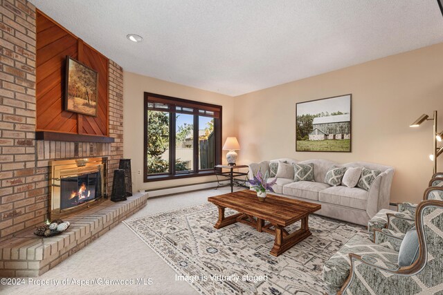 211 Meadow Ranch Dr Unit D5A, Snowmass Village, CO 81615 - carpeted living area with a fireplace, a textured ceiling, and a baseboard heating unit