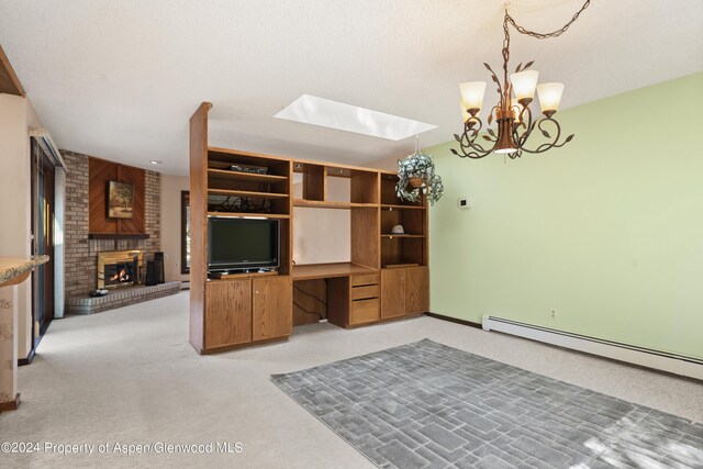 211 Meadow Ranch Dr Unit D5A, Snowmass Village, CO 81615 - unfurnished living room featuring light colored carpet, a fireplace, baseboard heating, a chandelier, and a skylight
