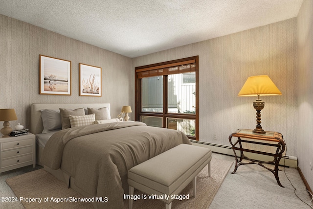 211 Meadow Ranch Dr Unit D5A, Snowmass Village, CO 81615 - bedroom featuring wallpapered walls, carpet flooring, a textured ceiling, and baseboards