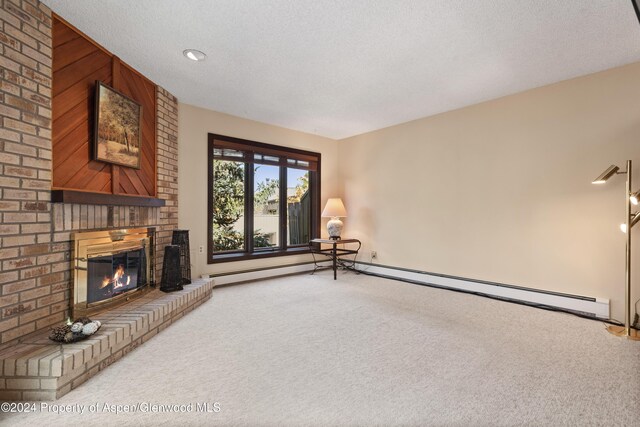 211 Meadow Ranch Dr Unit D5A, Snowmass Village, CO 81615 - unfurnished living room with carpet flooring, a brick fireplace, and a textured ceiling