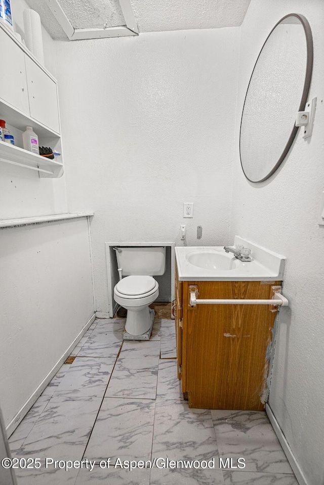 714 Westridge Rd, Craig, CO 81625 - bathroom with marble look tiles and vanity