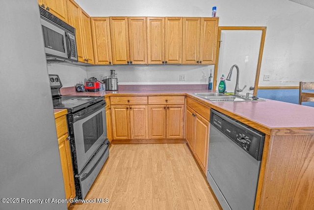 714 Westridge Rd, Craig, CO 81625 - kitchen featuring appliances with stainless steel finishes, light wood-type flooring, and a peninsula