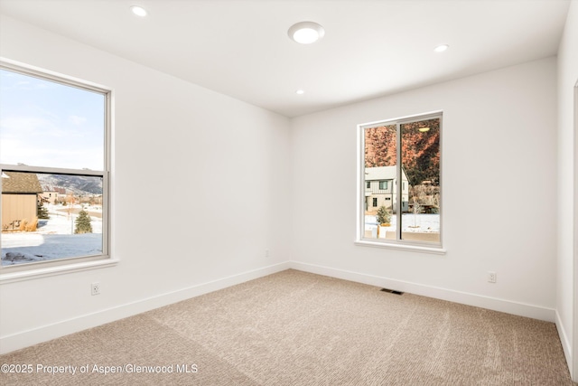 empty room featuring carpet floors