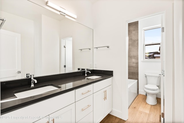 full bathroom featuring shower / tub combination, vanity, and toilet