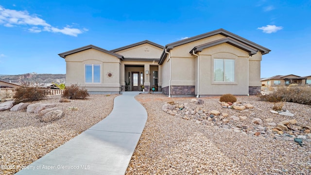 ranch-style home with stucco siding