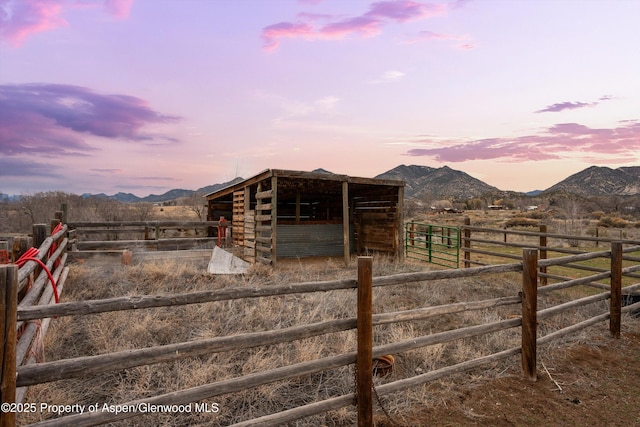 exterior space with a rural view and a mountain view