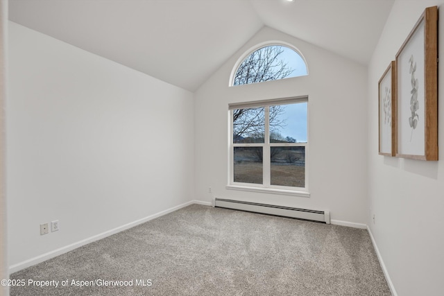 spare room with lofted ceiling, baseboards, baseboard heating, and carpet floors