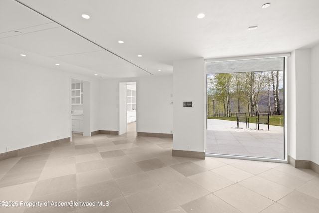 401 Eagle Park Dr, Aspen, CO 81611 - spare room featuring baseboards, recessed lighting, and a wall of windows