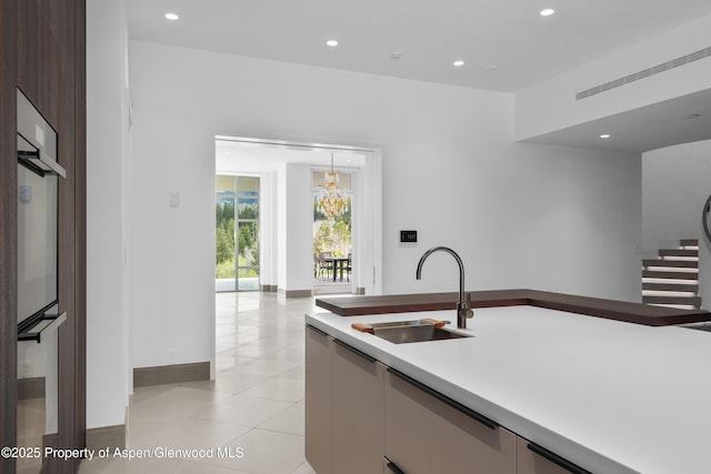 401 Eagle Park Dr, Aspen, CO 81611 - kitchen with a sink, recessed lighting, light tile patterned flooring, baseboards, and light countertops