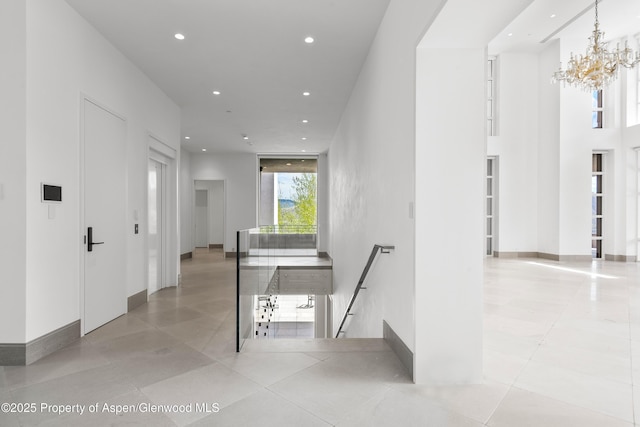 401 Eagle Park Dr, Aspen, CO 81611 - hallway with recessed lighting, a chandelier, and light tile patterned floors