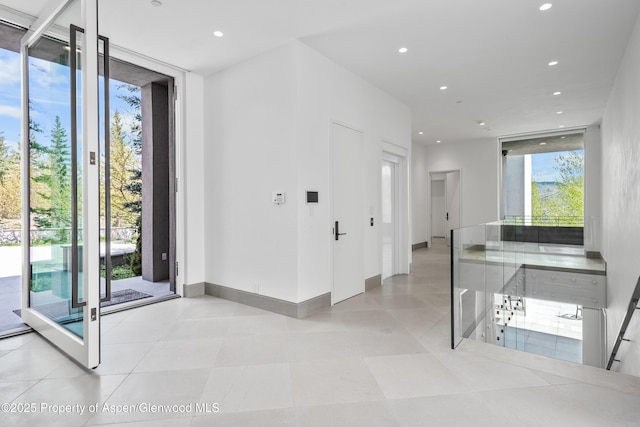 401 Eagle Park Dr, Aspen, CO 81611 - foyer with recessed lighting, a wall of windows, and baseboards
