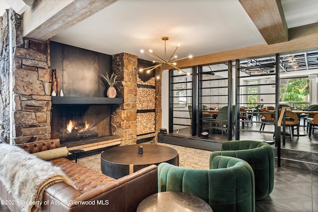 300 Carriage Way 623 & 625, Snowmass Village, CO 81615 - living room featuring a chandelier, a stone fireplace, and beamed ceiling