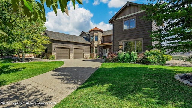 craftsman-style home featuring a front lawn and a garage