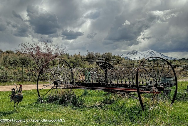 view of gate with a mountain view