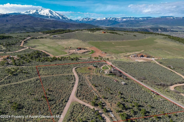 birds eye view of property with a mountain view