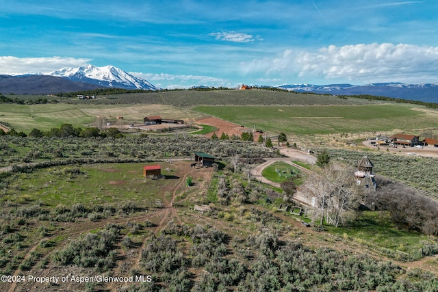 drone / aerial view with a mountain view and a rural view