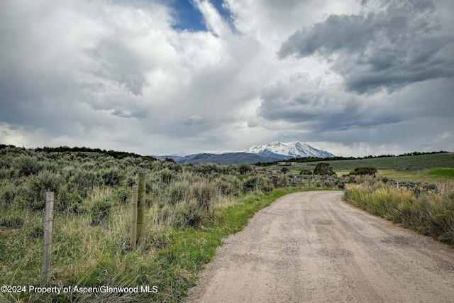 property view of mountains featuring a rural view