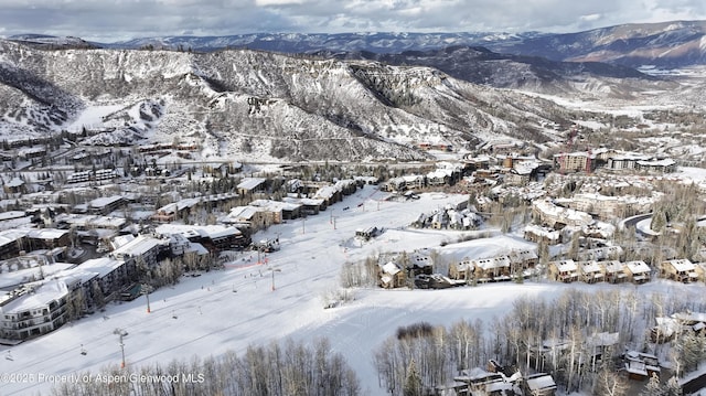 690 Carriage Way Unit D3D, Snowmass Village, CO 81615 - snowy aerial view featuring a mountain view
