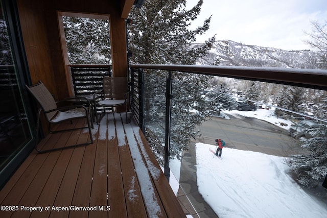 690 Carriage Way Unit D3D, Snowmass Village, CO 81615 - snow covered back of property featuring a mountain view
